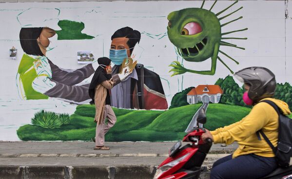 گرافیتی برای یادآوری پوشیدن ماسک در سومارتا - اسپوتنیک افغانستان  