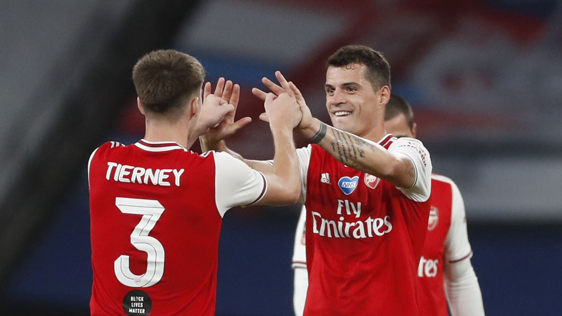 Soccer Football - FA Cup Semi Final - Arsenal v Manchester City - Wembley Stadium, London, Britain - July 18, 2020 Arsenal's Granit Xhaka and Kieran Tierney celebrate after the match, as play resumes behind closed doors following the outbreak of the coronavirus disease (COVID-19) - اسپوتنیک افغانستان  , 1920, 05.04.2022