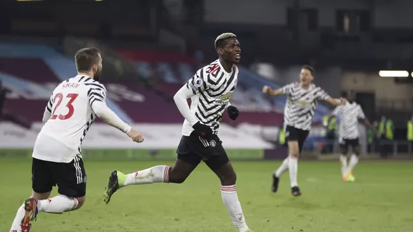 Paul Pogba wheels away after scoring for Manchester United against Burnley on 12 January 2021 - اسپوتنیک افغانستان  