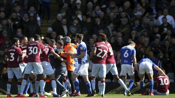 Aston Villa's Jack Grealish sits, nursing a sore head, after being punched by a Birmingham City fan at a game on 10 March 2019 - اسپوتنیک افغانستان  