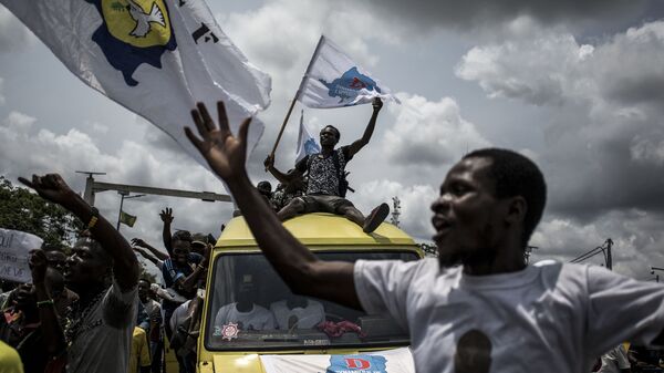Сторонники лидера радикального оппозиции республики Конго Мартэна Файюлу радуются началу его предвыборной кампании в Киншасе  - اسپوتنیک افغانستان  