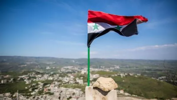 Флаг над свобожденной от боевиков крепости Крак де Шевалье в Сирии - اسپوتنیک افغانستان  