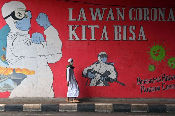 نقاشی دیواری با پیامی مبارزه با کرونا در اندونزیا. - اسپوتنیک افغانستان  