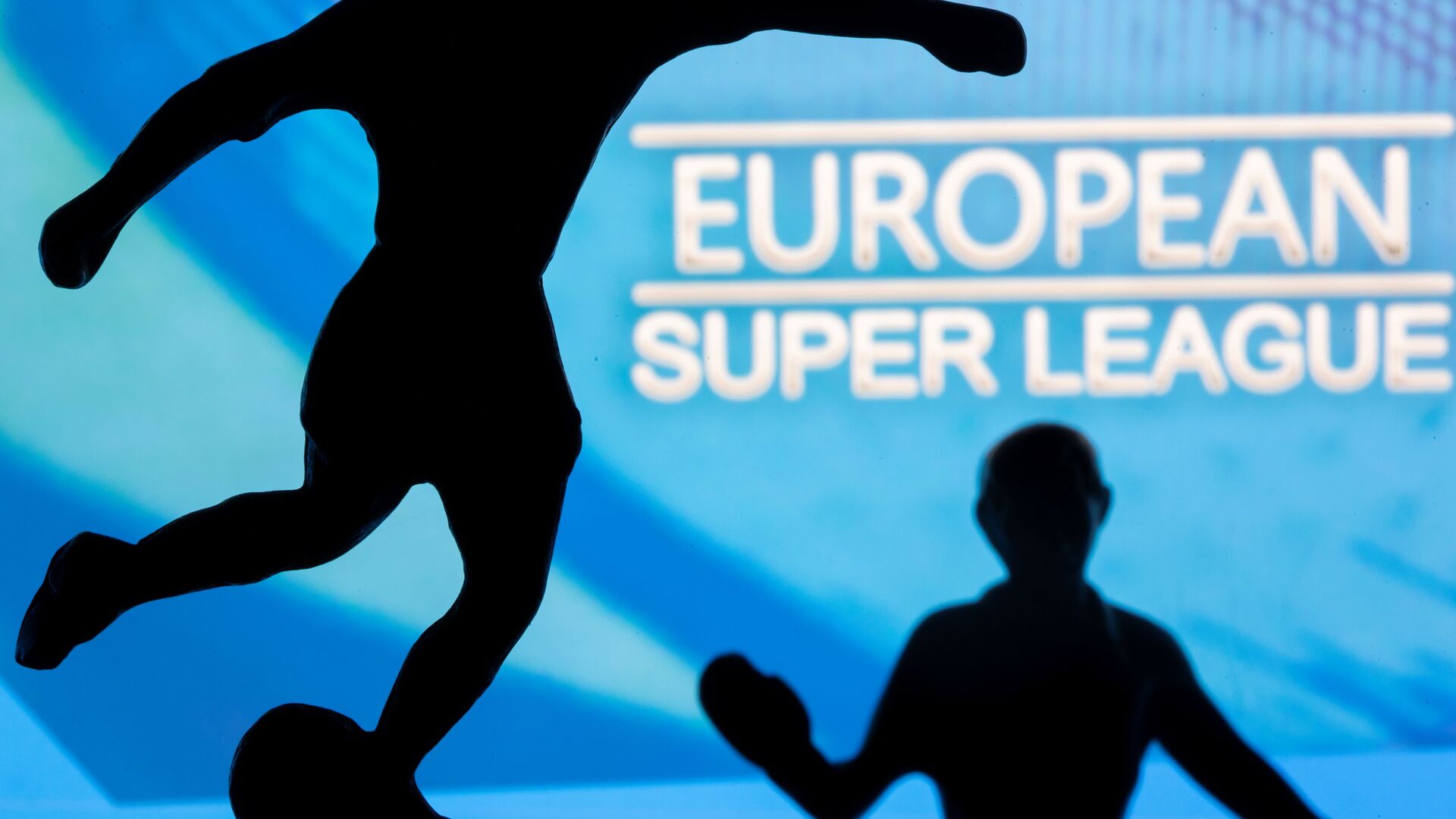 Metal figures of football players are seen in front of the words European Super League in this illustration taken April 20, 2021 - اسپوتنیک افغانستان  , 1920, 21.05.2021