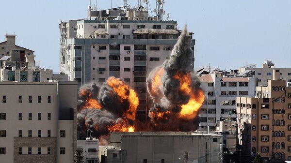 ВВС Израиля нанесли авиаудары по высотке в Газе, в которой расположены офисы американского информагентства Associated Press и катарского телеканала «Аль-Джазира» - اسپوتنیک افغانستان  