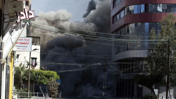 ВВС Израиля уничтожили высотку в Газе, в которой находились офисы американского информагентства Associated Press и катарского телеканала Al Jazeera - اسپوتنیک افغانستان  