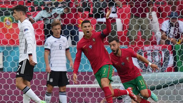Игроки сборных Германии и Португалии во время матча на  Euro 2020 - اسپوتنیک افغانستان  