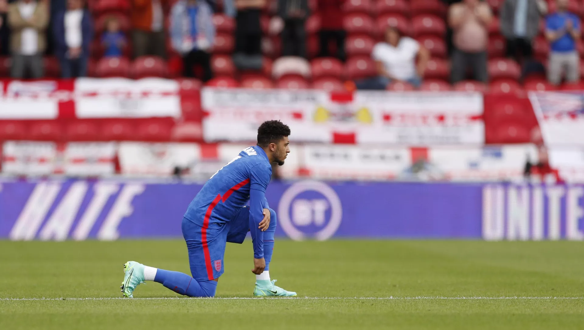 International Friendly - England v Romania - Riverside Stadium, Middlesbrough, Britain - June 6, 2021 England's Jadon Sancho kneels in support of the Black Lives Matter campaign before the match.