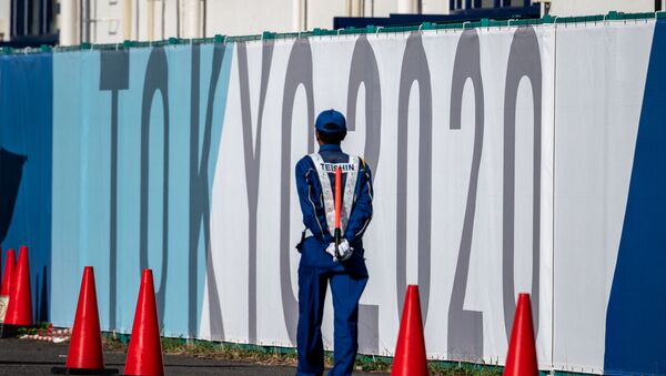 A security guard walks at the Olympic and Paralympic Village in Tokyo on July 15, 2021, ahead of the 2020 Tokyo Olympic Games which begins on July 23. - اسپوتنیک افغانستان  