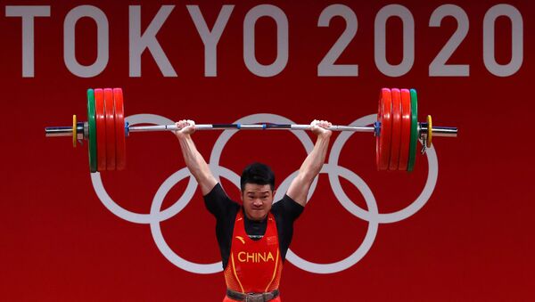 Tokyo 2020 Olympics - Weightlifting - Men's 73kg - Group A - Tokyo International Forum, Tokyo, Japan - July 28, 2021. Shi Zhiyong of China in action - اسپوتنیک افغانستان  