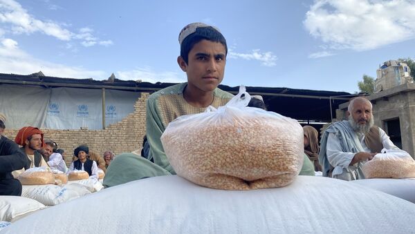 ارائه کمک های بشردوستانه برنامه جهانی غذا به مردم در ولایت قندهار. - اسپوتنیک افغانستان  