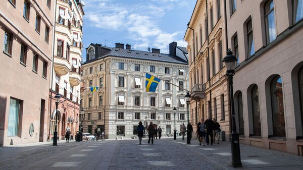 Шведские флаги на улице Стокгольма - اسپوتنیک افغانستان  