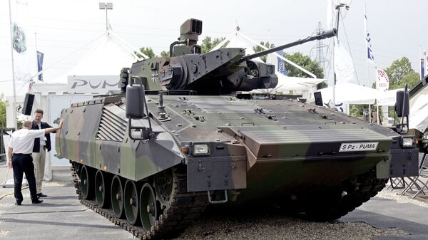 A German S Pz Puma equipped with an effective vision concept and a 30mm Mauser canon is on display at the Eurosatory arms show, in Villepinte, outside Paris, Wednesday, June 14, 2006. Several tank makers said the Iraq war has provided a welcome injection of ideas and cash for research into future tanks. - اسپوتنیک افغانستان  