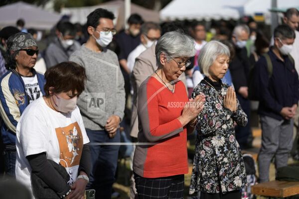 مردم برای یادبود فاجعه 311 پس از زلزله و سونامی در منطقه توهوکو در 12 سال پیش، در طی یک مراسم سالگرد در پارک هیبیا در توکیو، یک دقیقه سکوت می کنند. - اسپوتنیک افغانستان  