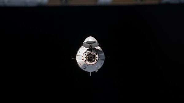 Космический корабль Crew Dragon перед стыковкой с Международной космической станцией - اسپوتنیک افغانستان  