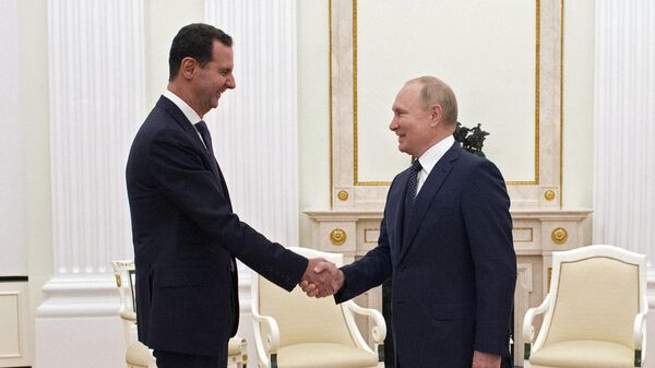 Президент Сирии Башар Асад и президент РФ Владимир Путин и во время встречи. Архивное фото - اسپوتنیک افغانستان  