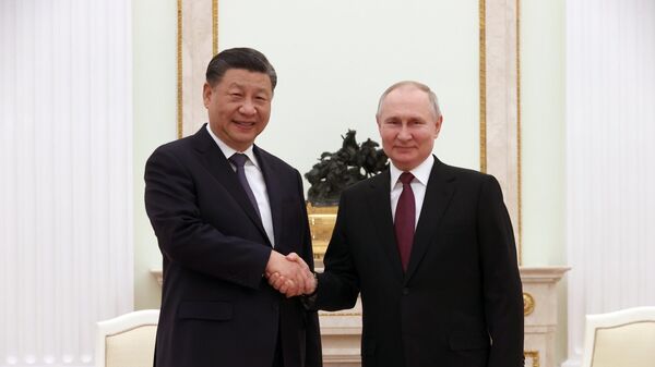Председатель КНР Си Цзиньпин и президент России Владимир Путин на встрече в Кремле - اسپوتنیک افغانستان  
