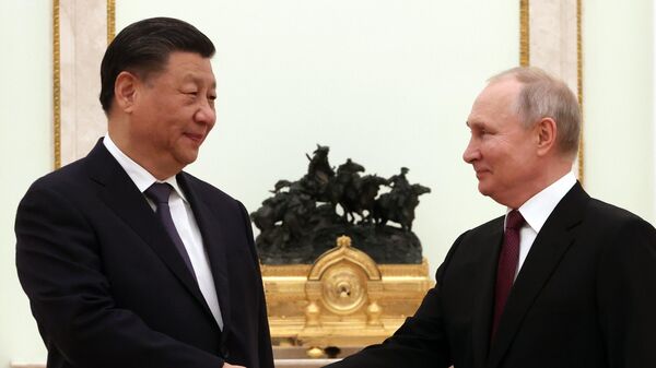 Председатель КНР Си Цзиньпин и президент России Владимир Путин на встрече в Кремле - اسپوتنیک افغانستان  