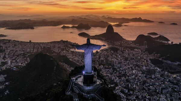 Восход солнца перед статуей Христа-Искупителя в Рио-де-Жанейро, Бразилия - اسپوتنیک افغانستان  