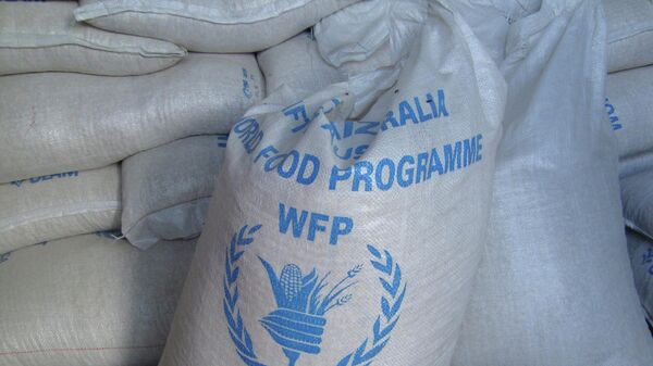 In this photo of Monday, Aug. 8, 2011 sacks of World Food Program, WFP, food is seen on a truck before being dropped off for storage in warehouses in the former Somali water agency that runs the biggest sell off of food aid in Mogadishu. - اسپوتنیک افغانستان  