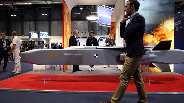 A visitor walks past a guide missile ground target KEPD 350 manufactured by the Swedish-German company Taurus at the International Defence and Security fair of Madrid, on May 17, 2023.  - اسپوتنیک افغانستان  