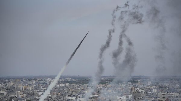 Rockets are launched by Palestinian militants from the Gaza Strip towards Israel, in Gaza, Saturday, Oct. 7, 2023.  - اسپوتنیک افغانستان  