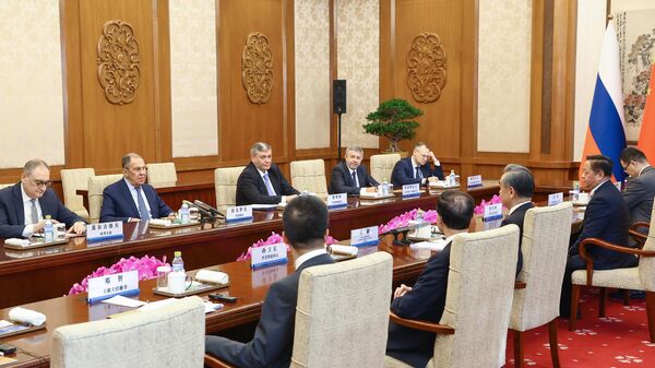 Министр иностранных дел РФ Сергей Лавров и министр иностранных дел КНР Ван И во время встречи в Пекине - اسپوتنیک افغانستان  