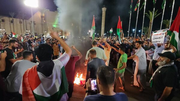 Протесты в Ливии после удара по больнице Аль-Ахли в Газе  - اسپوتنیک افغانستان  