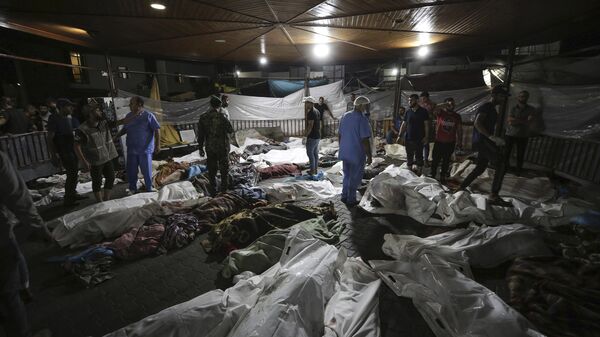 Bodies of Palestinians killed by an explosion at the Ahli Arab hospital - اسپوتنیک افغانستان  