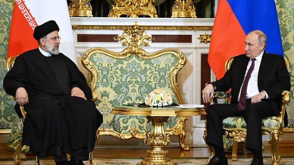 Президент Ирана Эбрахим Раиси и президент РФ Владимир Путин во время встречи в Москве - اسپوتنیک افغانستان  