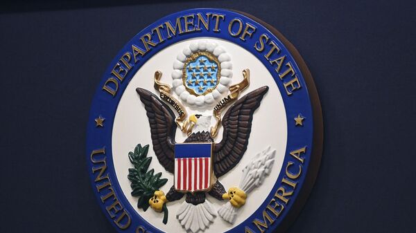 The State Department seal is seen on the briefing room lectern ahead of a briefing by State Department spokesperson Ned Price at the State Department in Washington, Monday, Janu 31, 2022. - اسپوتنیک افغانستان  
