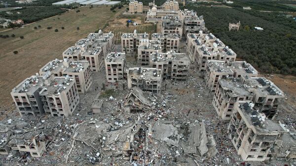 Вид с воздуха на разрушения после израильских ударов по Вади Газа, в центральной части сектора Газа - اسپوتنیک افغانستان  