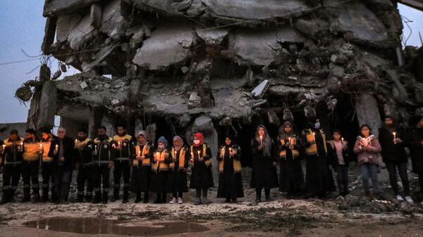 اعضای دفاع مدنی سوریه در اولین سالگرد زلزله در حلب سوریه - اسپوتنیک افغانستان  