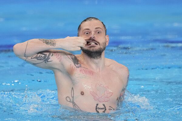 رنو بارال از بلجیم در مسابقات شنای جهان در شنای انفرادی مردان قطر. - اسپوتنیک افغانستان  