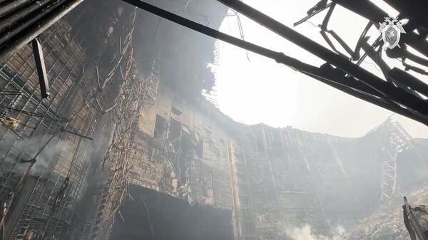 Здание концертного зала Крокус Сити Холл, где произошла стрельба, и начался пожар - اسپوتنیک افغانستان  