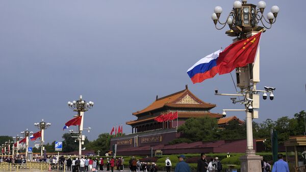 Флаги России и Китая на улицах Пекина - اسپوتنیک افغانستان  