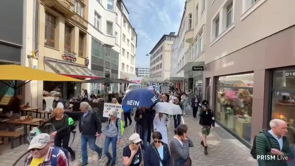 راهپیمایی در آلمان در برابر نامزد نخست وزیری آینده و سیاست‌های نظامی - اسپوتنیک افغانستان  