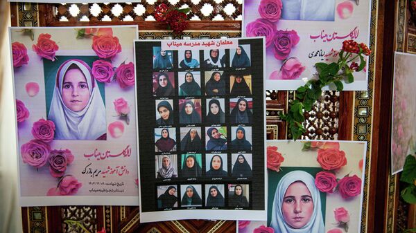 Portraits of school children from the Shajarah Tayyebeh Elementary School in Minab, who were killed in a U.S strike are displayed during a press conference by Iranian Ambassador to Tunisia Massoud Hosseinian, in Tunis, Tunisia, Thursday, March 12, 2026. (AP Photo/Ons Abid) - اسپوتنیک افغانستان  
