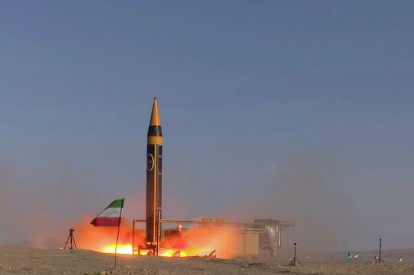 In this photo released by the Iranian Defense Ministry on May 25, 2023, Khorramshahr-4 missile is launched at an undisclosed location, Iran (Iranian Defense Ministry via AP) - اسپوتنیک افغانستان  