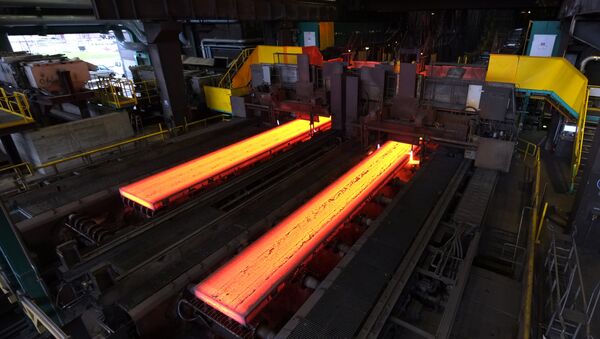 The picture shows red hot steel being flattened in the hot rolling plant at the ThyssenKrupp steel mill Hamborn pictured on December 12, 2014 in Duisburg , western Germany - اسپوتنیک افغانستان  