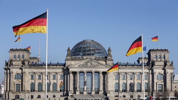 German flags wave in front of the Reichstag building, host of the German Federal Parliament Bundestag, in Berlin, Germany. (File) - اسپوتنیک افغانستان  