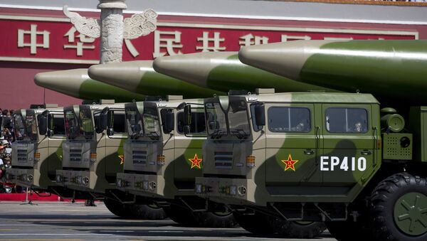 Military vehicles carrying DF-26 ballistic missiles drive past Tiananmen Gate during a military parade at Tiananmen Square in Beijing on September 3, 2015, to mark the 70th anniversary of victory over Japan and the end of World War II - اسپوتنیک افغانستان  