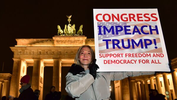 A protester shows a banner during an anti Donald Trump rally, on the day of his inauguration as US President, in front of Brandenburg Gate on January 20, 2017 in Berlin - اسپوتنیک افغانستان  