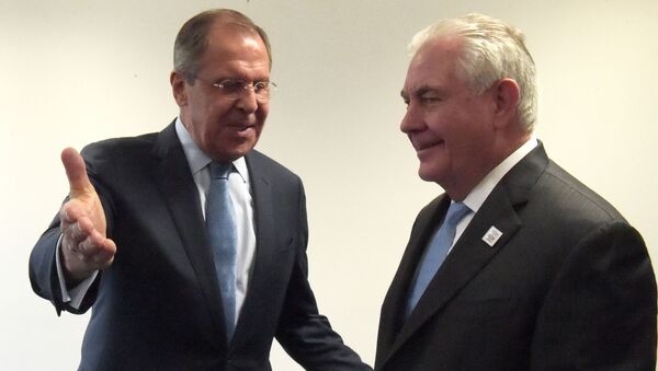 Министр иностранных дел РФ Сергей Лавров и госсекретарь США Рекс Тиллерсон на встрече глав МИД G20 в Бонне - اسپوتنیک افغانستان  