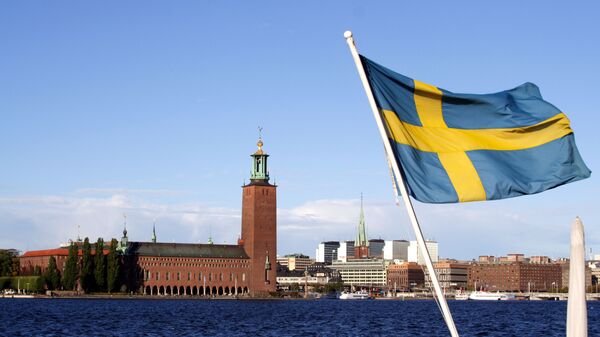 Шведский флаг на фоне Стокгольмской ратуши - اسپوتنیک افغانستان  
