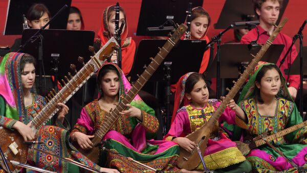 Afghanistan's first all-female orchestra performs during the closing ceremony of the World Economic Forum on January 20,2017 in Davos - اسپوتنیک افغانستان  
