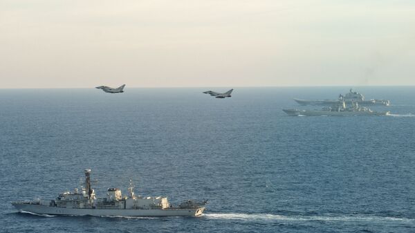 Британские ВМС и ВВС сопровождают авианосец Адмирал Кузнецов  - اسپوتنیک افغانستان  