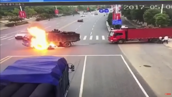 Motorcycle Bursts Into Flames After Crash - اسپوتنیک افغانستان  