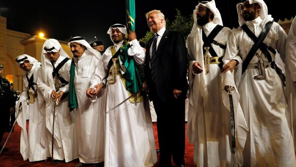 U.S. President Donald Trump dances with a sword as he arrives to a welcome ceremony at Al Murabba Palace in Riyadh, Saudi Arabia May 20, 2017 - اسپوتنیک افغانستان  