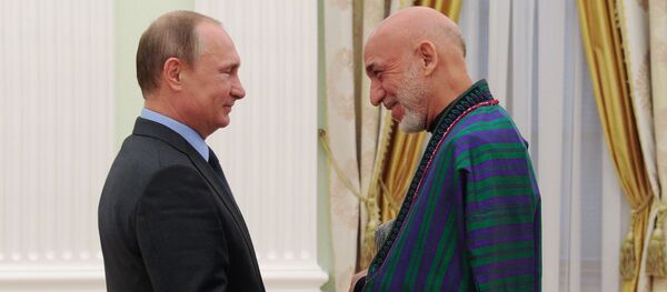 Президент России Владимир Путин и экс-президент Афганистана Хамид Карзай на встрече в Кремле Президент России Владимир Путин и экс-президент Афганистана Хамид Карзай на встрече в Кремле - اسپوتنیک افغانستان